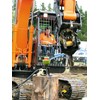 Craig Crowley of Whakatane sucessfully peeling a watermelon as part of the National Excavator Operator competition