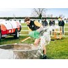 Joseph Watts empties a water trough during the agri sports challenge