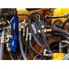 Close up of hydraulic pressure hoses.