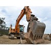 Hyundai excavator grabbing rock