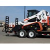 Once on the trailer, compact loader operators should lower the attachment to the floor of the trailer, stop the engine and engage the parking brake.