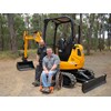 JCB’s Brendan Clarke and safety speaker James Wood with the modified 8025 ZTS mini excavator.
