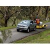 Ford Ranger ute towing excavator