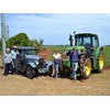 Margaret, Bob, Nicole, David and Chris Strathdee on the farm alongside their Buick and John Deere tractor.