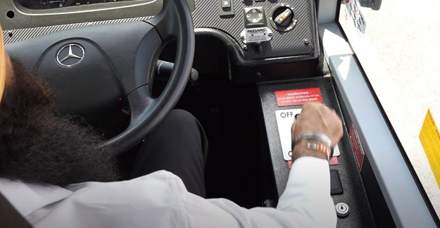Driver in bus showing hand operating 7.21min.jpg