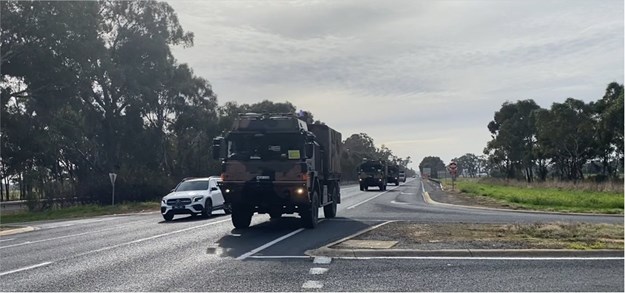 Self driving army trucks fly along Hume Highway