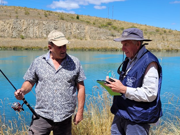 CSIFG-1-Honorary-Fish-Game-Ranger-Allan-Gillespie-checks-on-compliant-angler-Hans-Van-Leeuwen-at-the-Ohau-B-Canal-near-Twizel-photo-by-CSI-Fish-Game-Rhys-Adams.jpeg