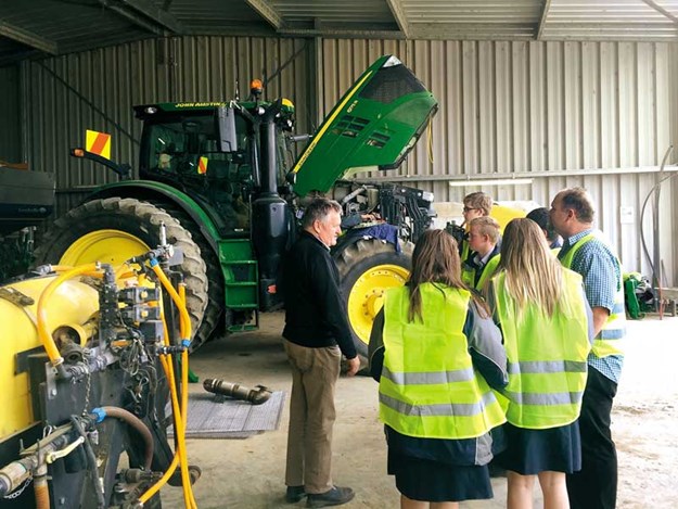 John-Austin-shows-TeenAg-students-around-his-workshop.jpg