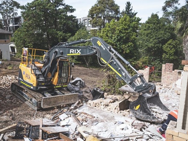 The Hyundai R145CRD-9 excavator demolishing houses