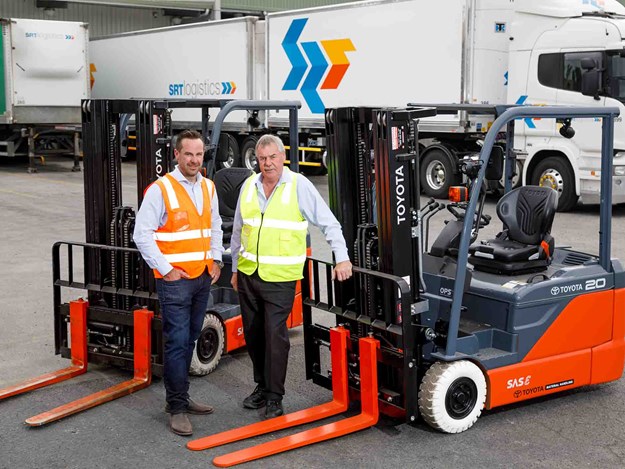 SRT Logistics CEO Rob Miller (left) with TMHA Hobart area sales manager, Rodney Jones, and the first of 36 new Toyota Material Handling forklifts and pallet jacks