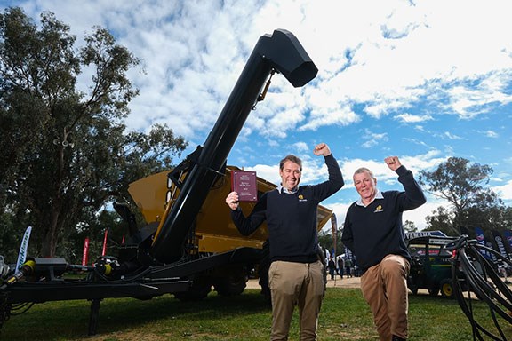 Heath and Bruce Hutcheon, Coolamon, celebrate the Henty Machine of the Year Award for the Coolamon Spreader Chaser