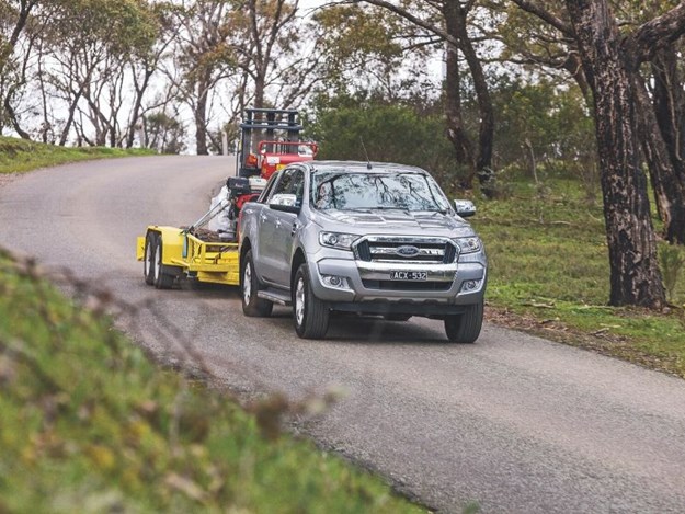 A Ford Ranger ute towing a trailer 