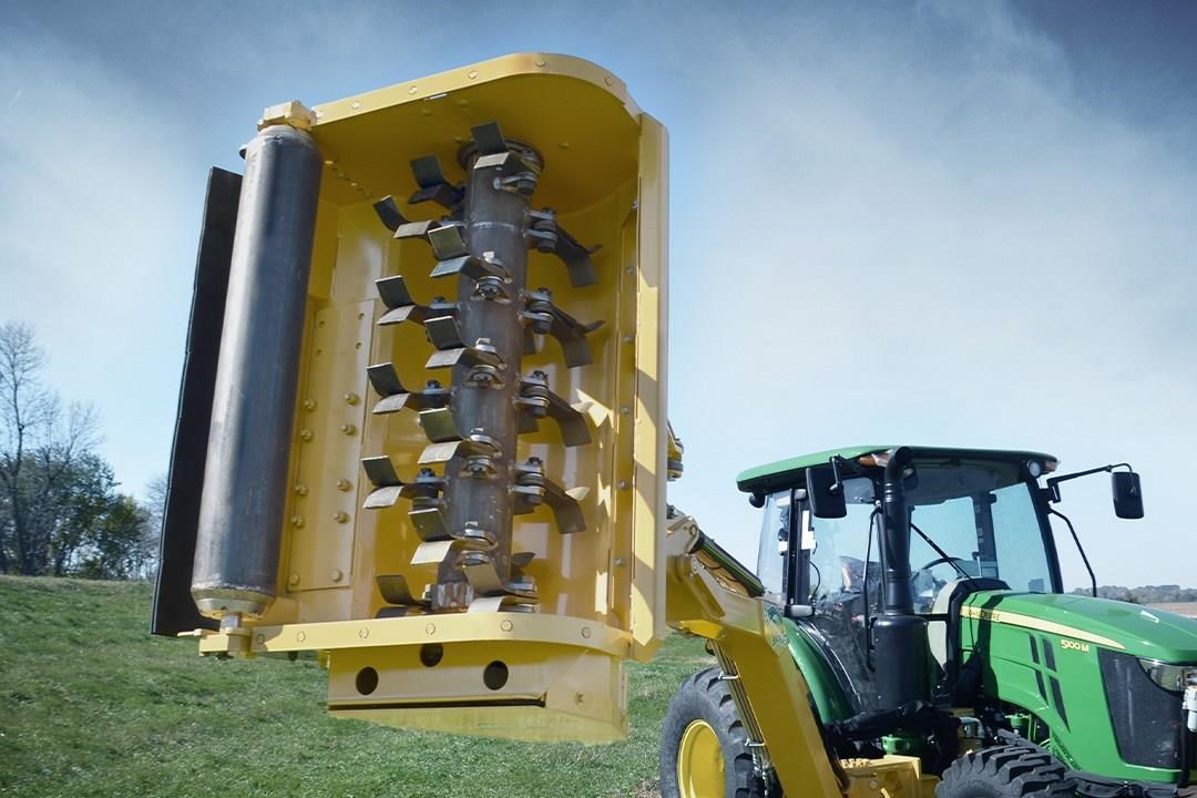 Tractor with boom mower for online sale