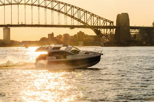 Luxury boat under Sydney Harbour Bridge