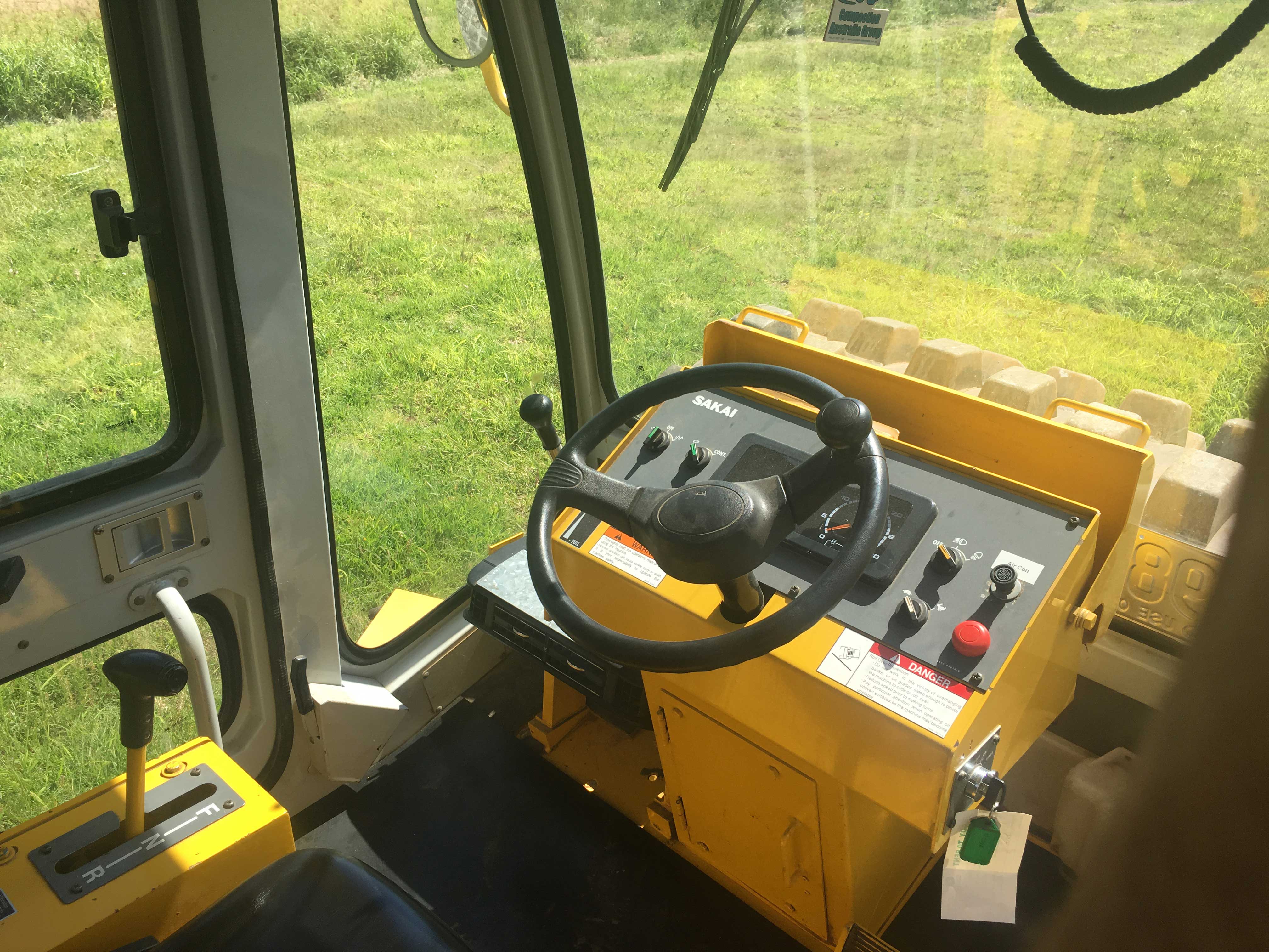 Inside the cab of the Sakai SV512TF padfoot roller