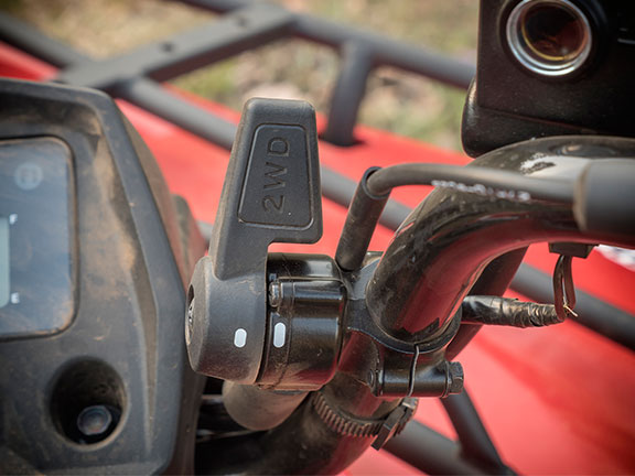 The 4WD actuator is a small lever located on the right hand side of the handlebar.