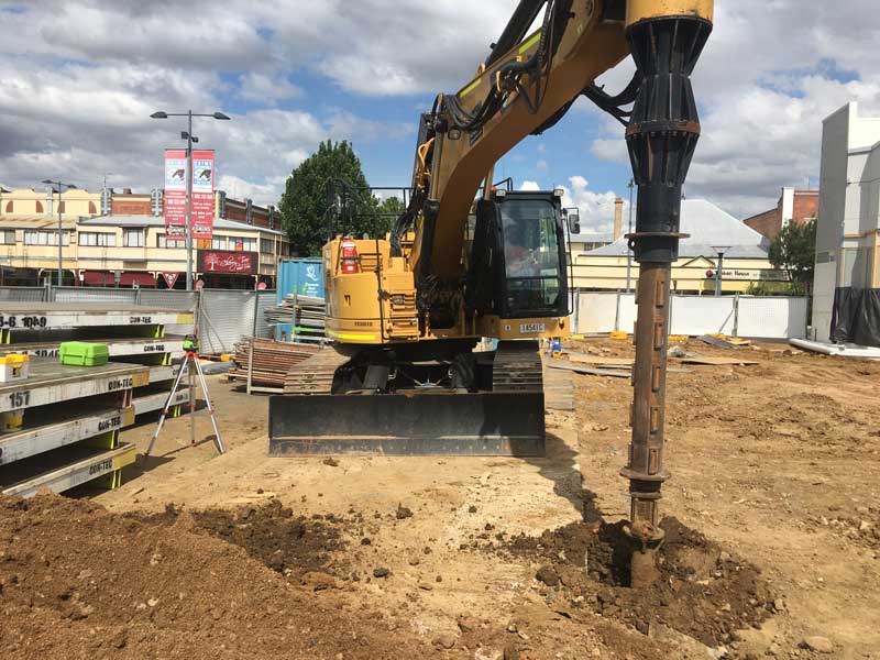 Cat 328D LCR excavator with piling drill