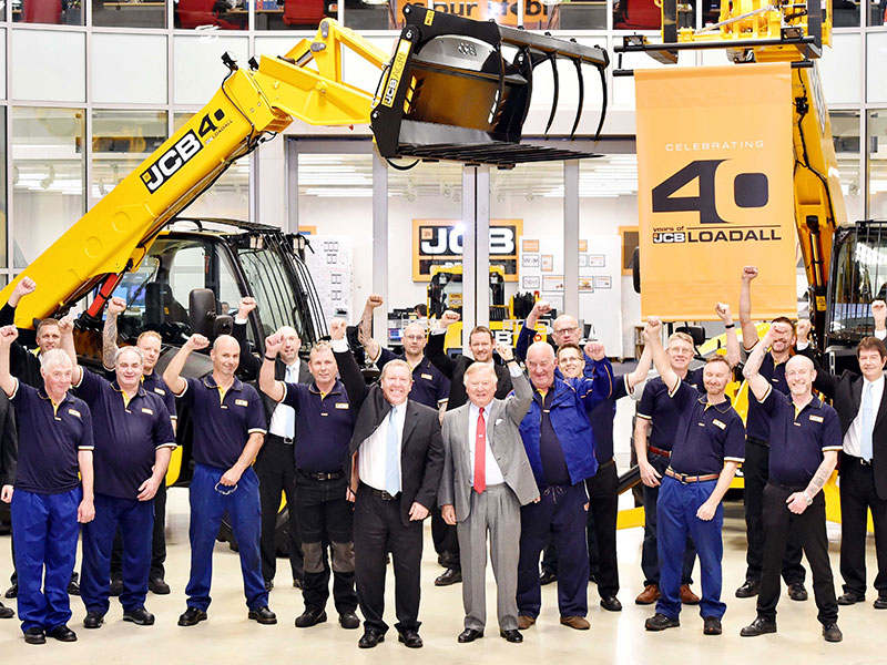JCB Chairman Lord Bamford celebrating the Loadall with with staff