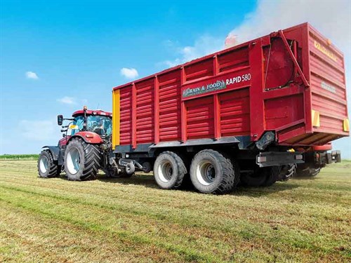 Tractor -and -loader -wagon -full -of -grass