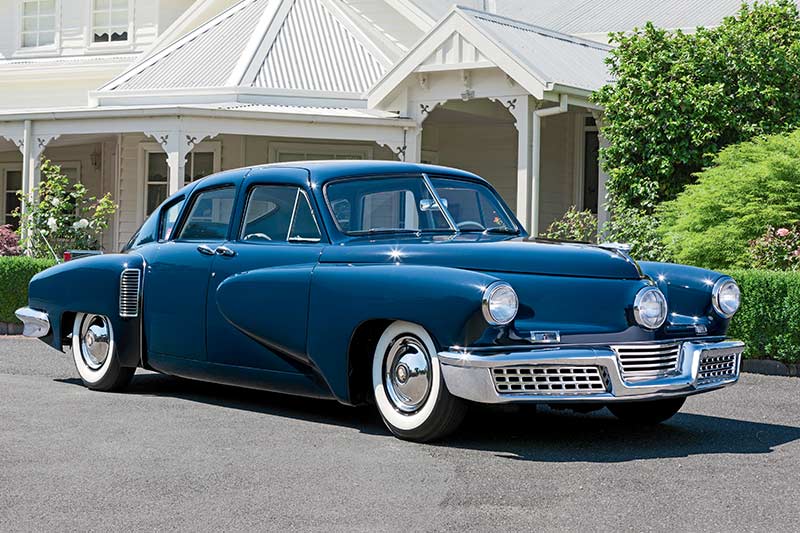 Preston Tucker loading luggage in trunk  Classic cars, American classic  cars, Old vintage cars